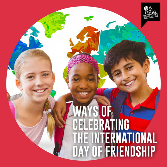 Three happy children of different nationalities smile at the camera