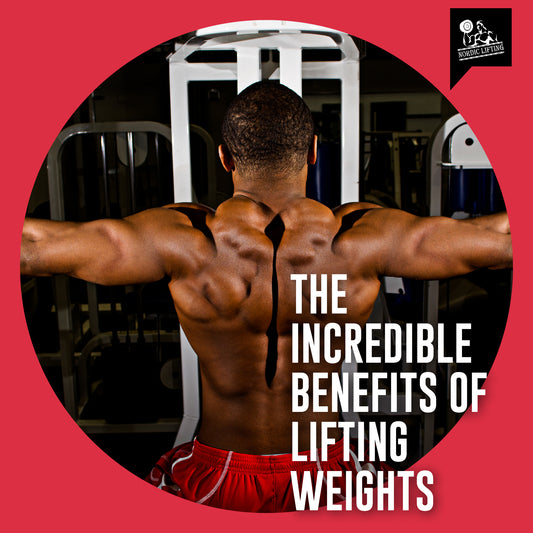 A bodybuilder in red shorts flexes his arm and shoulder muscles